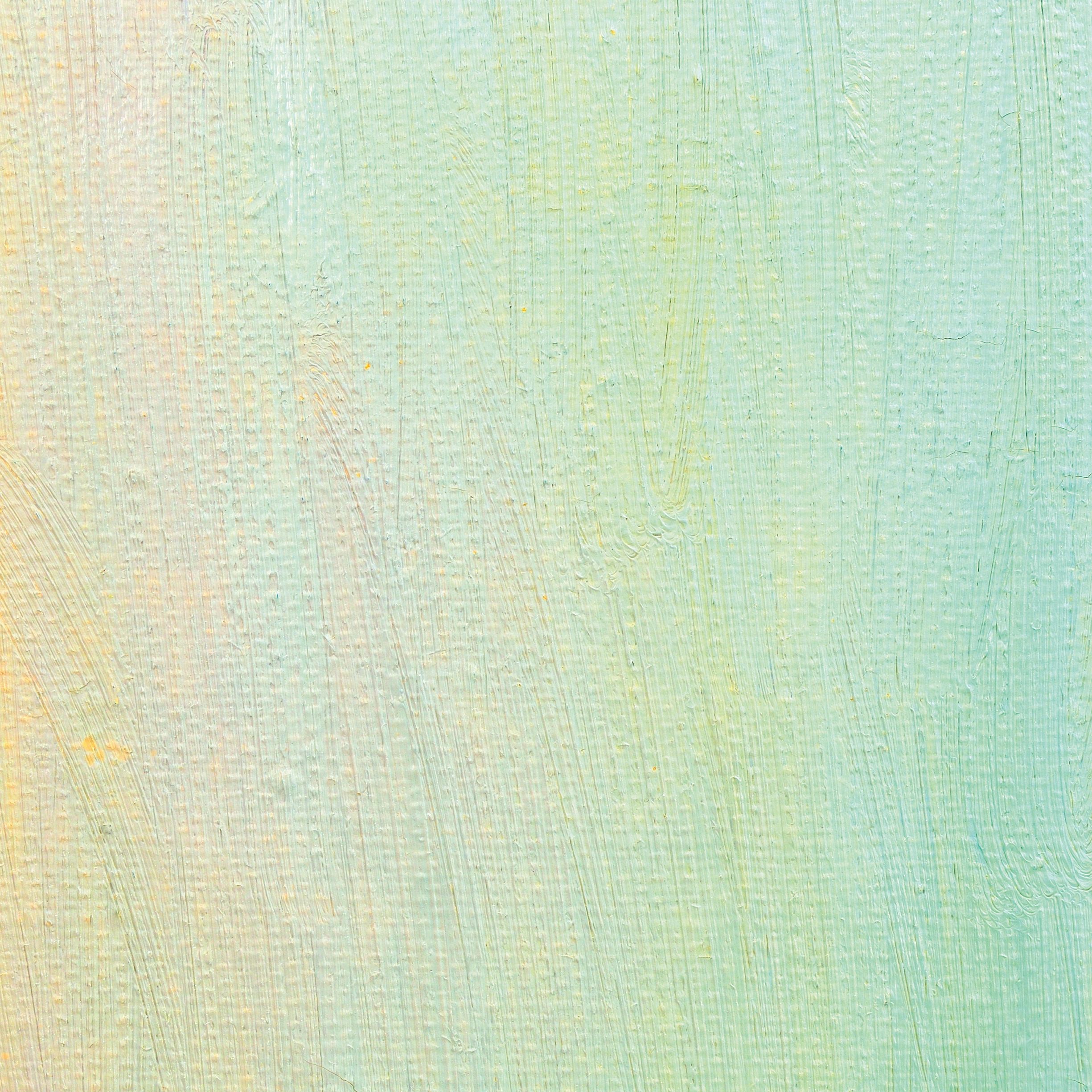 Vertical macro view of textured oil paint canvas